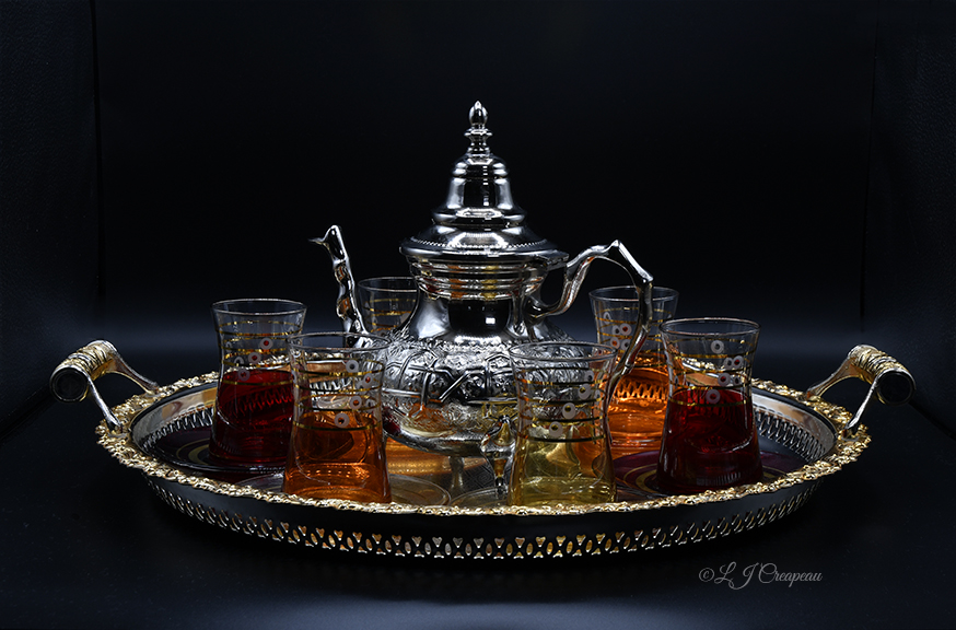 Black background product photography. Tea set from India