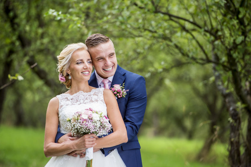 Bride and Groom in apple orchard